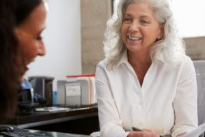 Senior professional woman meeting in office with young woman