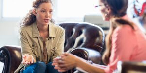 Psychologist having session with her patient in office