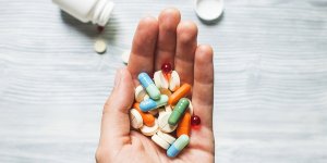 Colorful pills and medicines in the hand