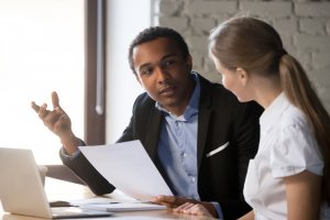 boss discussing how to cover rehab with employee