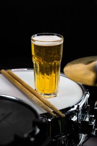 beer on drumset showing link between musicians and addiction